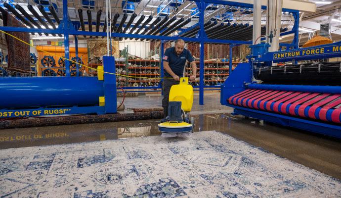 Cleaning area rug using equipment