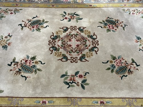 Close-up of a visibly dirty residential oriental area rug with intricate floral patterns, showing discoloration and soil buildup before professional cleaning by Dalworth Rug Cleaning.