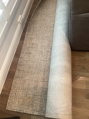 Professional residential rug cleaning featuring deep soil extraction and targeted stain removal to refresh the appearance and comfort of a home living space.