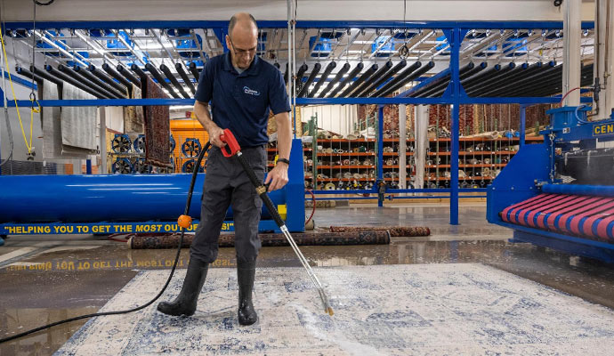 An expert cleaning rug