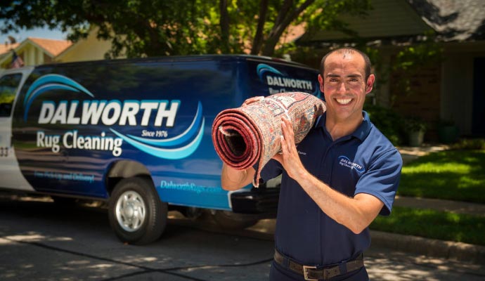 Dalworth rug cleaning service van with a professional team member