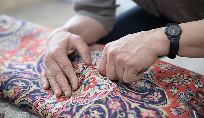 Rug backing repair service