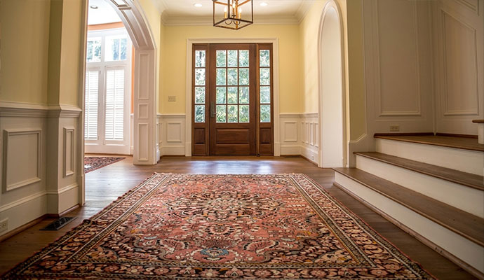 Clean rug placed on wooden floor